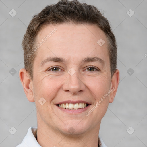 Joyful white adult male with short  brown hair and brown eyes