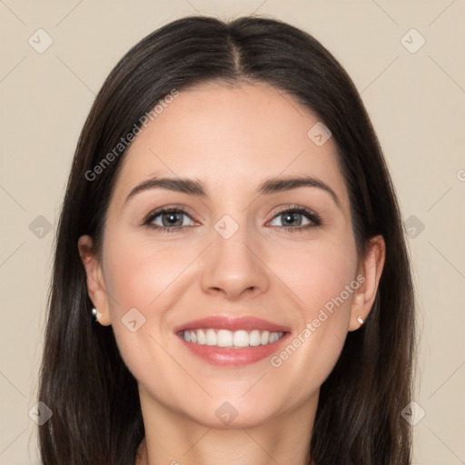 Joyful white young-adult female with long  brown hair and brown eyes