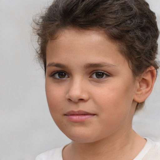 Joyful white child female with short  brown hair and brown eyes