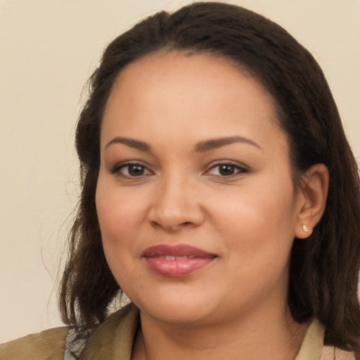 Joyful latino young-adult female with medium  brown hair and brown eyes