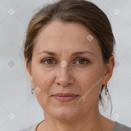 Joyful white adult female with short  brown hair and brown eyes