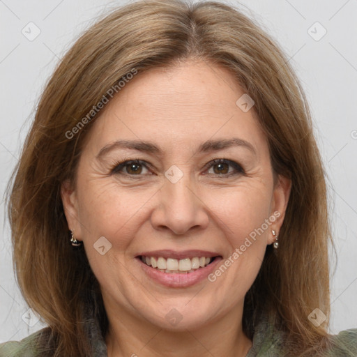 Joyful white adult female with medium  brown hair and brown eyes