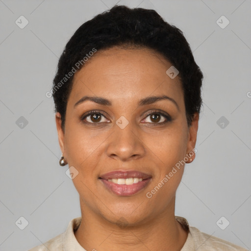 Joyful black young-adult female with short  black hair and brown eyes