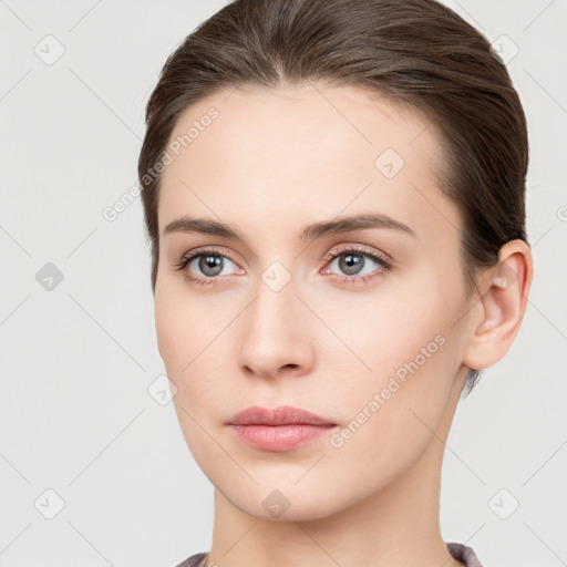 Neutral white young-adult female with short  brown hair and brown eyes