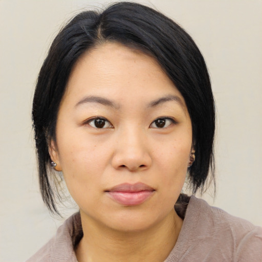 Neutral asian young-adult female with medium  black hair and brown eyes
