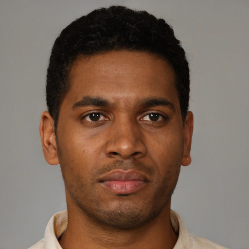 Neutral black young-adult male with short  brown hair and brown eyes