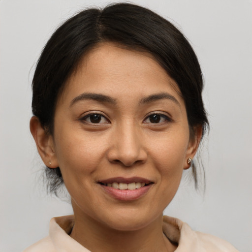 Joyful white young-adult female with medium  brown hair and brown eyes