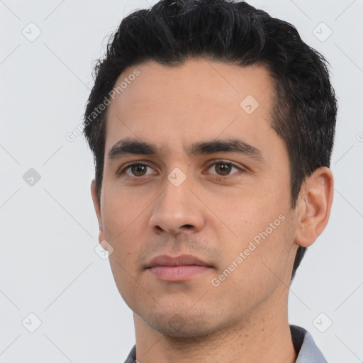 Neutral white young-adult male with short  black hair and brown eyes