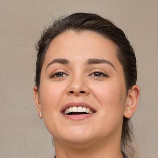 Joyful white young-adult female with medium  brown hair and brown eyes