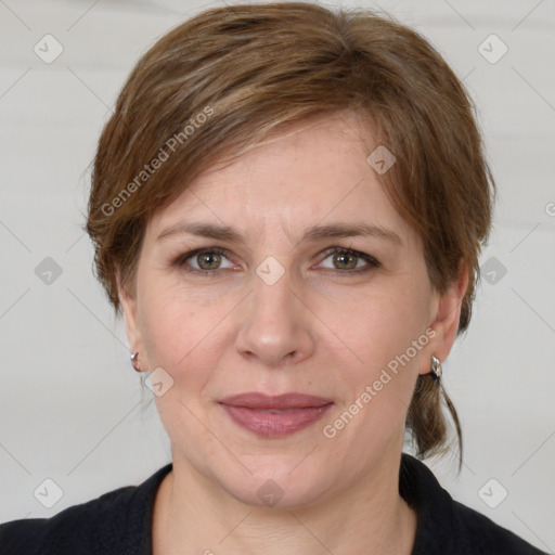 Joyful white adult female with medium  brown hair and grey eyes