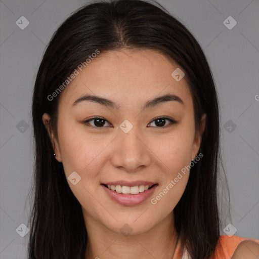 Joyful asian young-adult female with long  brown hair and brown eyes