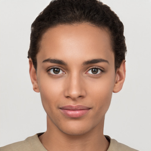 Neutral latino young-adult female with short  brown hair and brown eyes