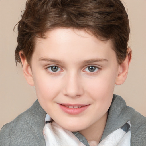 Joyful white child female with short  brown hair and blue eyes