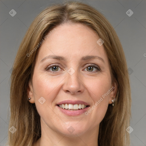 Joyful white adult female with medium  brown hair and green eyes