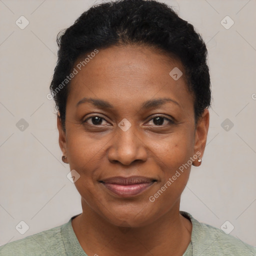 Joyful black young-adult female with short  black hair and brown eyes