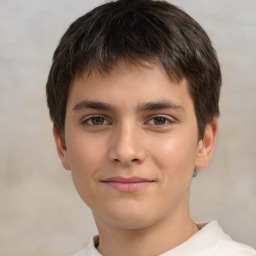 Joyful white child male with short  brown hair and brown eyes