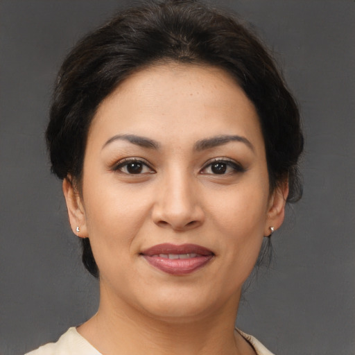 Joyful asian young-adult female with medium  brown hair and brown eyes