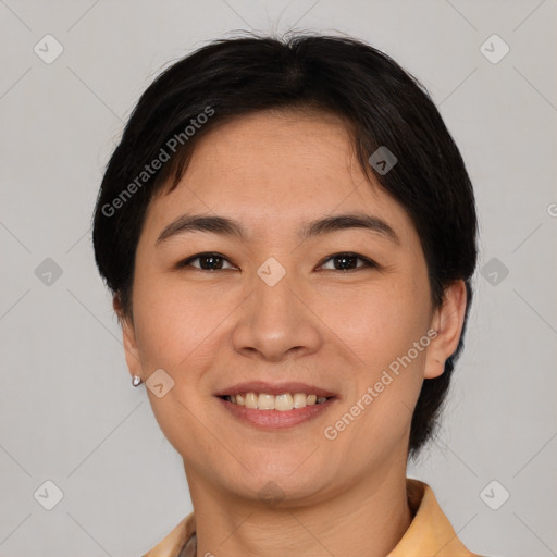 Joyful asian young-adult female with short  brown hair and brown eyes