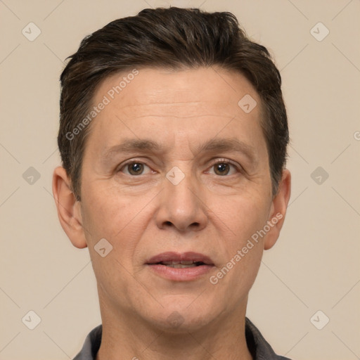 Joyful white adult male with short  brown hair and brown eyes