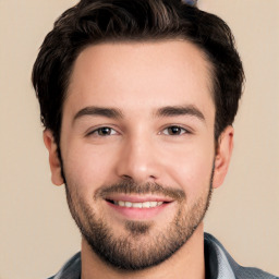 Joyful white young-adult male with short  black hair and brown eyes