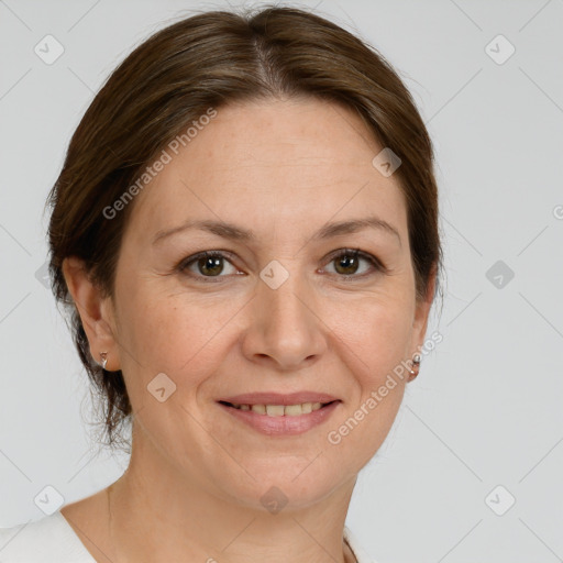 Joyful white adult female with medium  brown hair and grey eyes