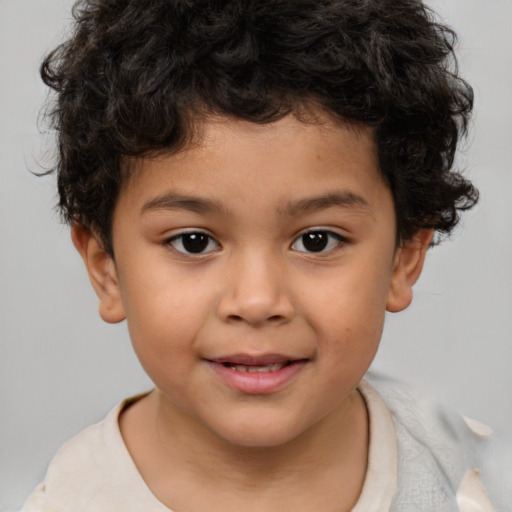 Joyful white child male with short  brown hair and brown eyes