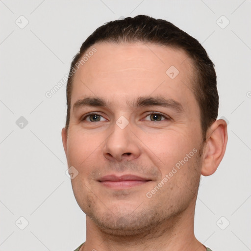 Joyful white young-adult male with short  brown hair and brown eyes