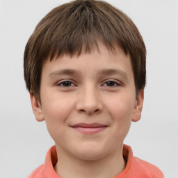 Joyful white child male with short  brown hair and brown eyes