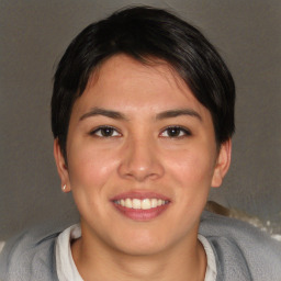 Joyful asian young-adult female with short  brown hair and brown eyes