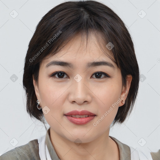 Joyful asian young-adult female with medium  brown hair and brown eyes
