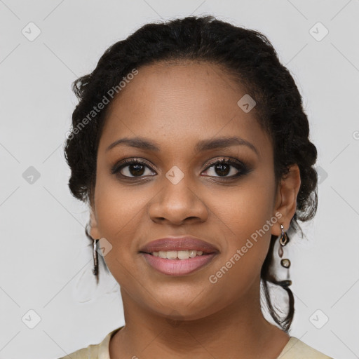 Joyful black young-adult female with long  brown hair and brown eyes