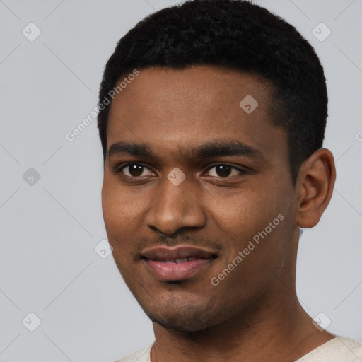 Joyful black young-adult male with short  black hair and brown eyes