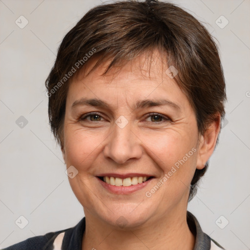 Joyful white adult female with medium  brown hair and brown eyes