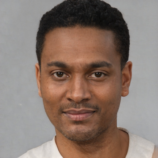 Neutral latino young-adult male with short  black hair and brown eyes