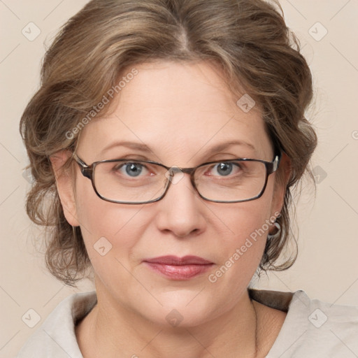 Joyful white adult female with medium  brown hair and blue eyes