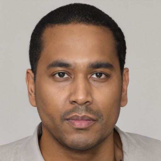 Neutral black young-adult male with short  black hair and brown eyes
