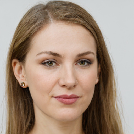 Joyful white young-adult female with long  brown hair and green eyes