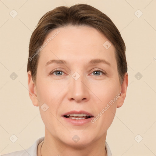 Joyful white adult female with short  brown hair and brown eyes