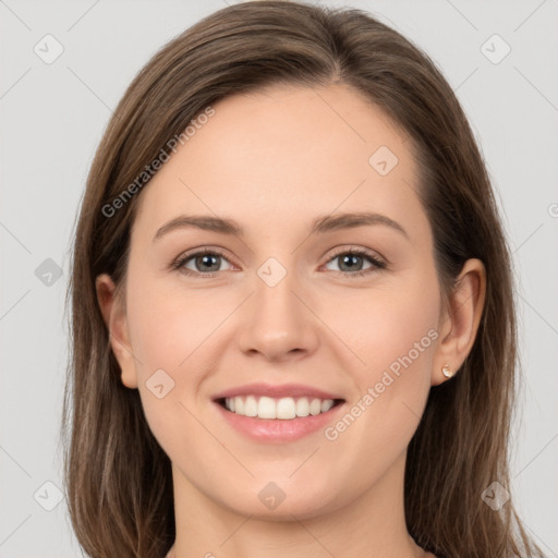 Joyful white young-adult female with long  brown hair and grey eyes