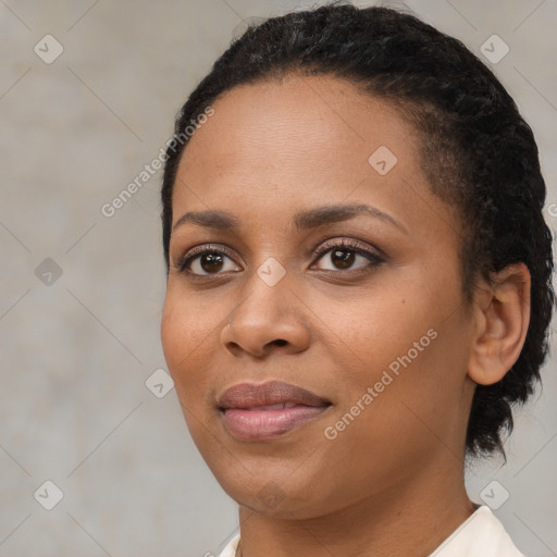 Joyful black young-adult female with short  black hair and brown eyes