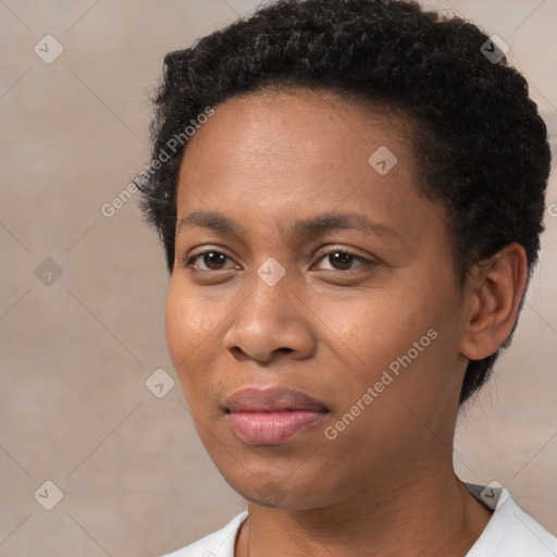 Joyful black young-adult female with short  brown hair and brown eyes