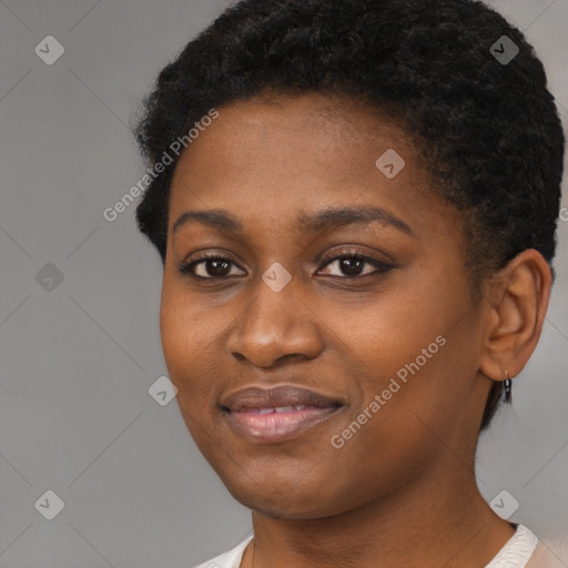 Joyful black young-adult female with short  brown hair and brown eyes