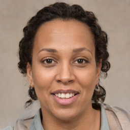 Joyful white adult female with short  brown hair and brown eyes