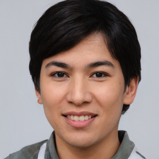Joyful asian young-adult female with short  black hair and brown eyes
