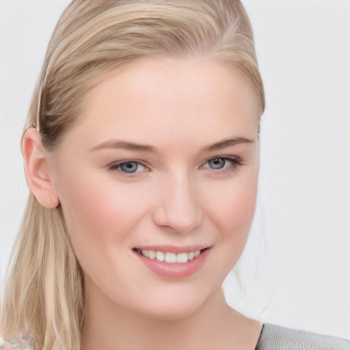 Joyful white young-adult female with medium  brown hair and blue eyes