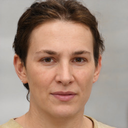 Joyful white adult female with short  brown hair and brown eyes