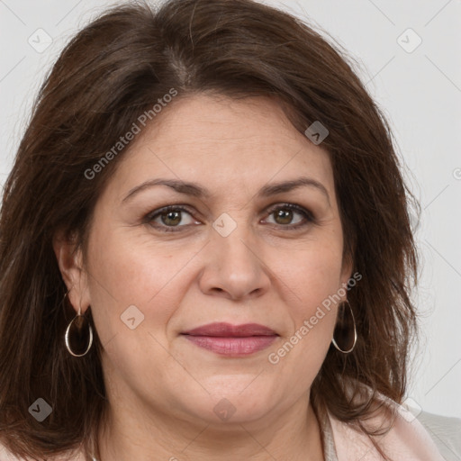 Joyful white adult female with medium  brown hair and brown eyes