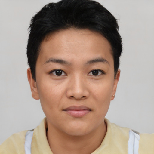 Joyful asian young-adult female with short  black hair and brown eyes