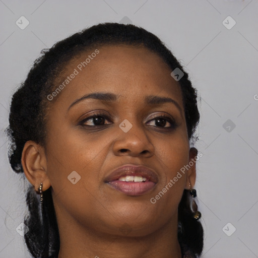 Joyful black young-adult female with long  brown hair and brown eyes