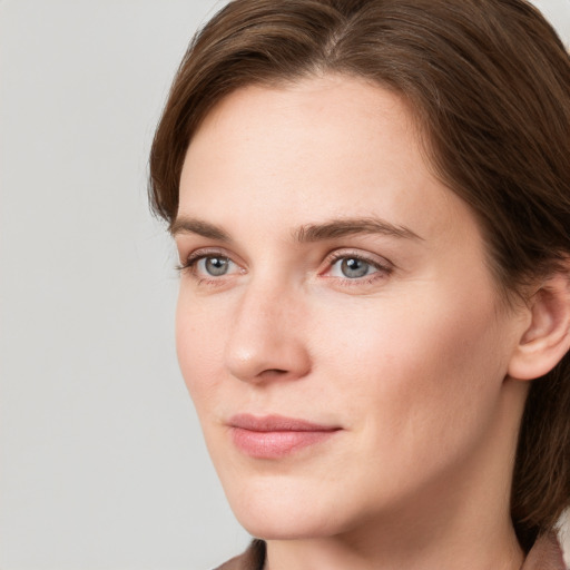 Neutral white young-adult female with long  brown hair and grey eyes